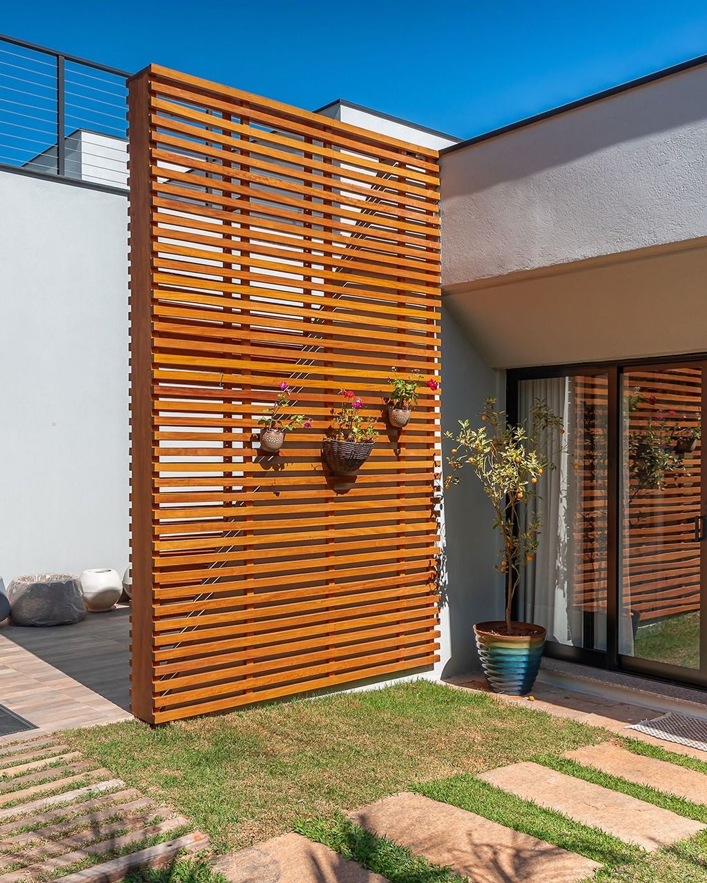 Fluted timber feature wall with hanging planters
